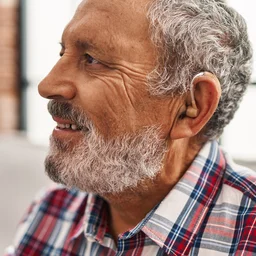 elderly man wearing hearing aid