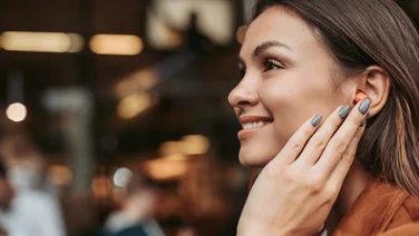 woman with bluetooth hearing aid