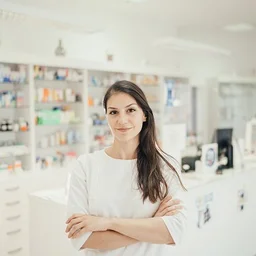 pharmacist in front of pharmacy counter